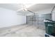 Spacious two car garage with concrete floor and garage door at 1227 E Sheena Dr, Phoenix, AZ 85022