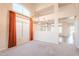 Bright living room featuring tall ceilings, large windows, and modern light fixture at 1227 E Sheena Dr, Phoenix, AZ 85022