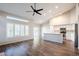 Living room featuring wood floors and a large window view to the backyard at 1227 E Sheena Dr, Phoenix, AZ 85022