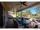 Covered brick patio with views of manicured lawns and golf course at 1227 E Sheena Dr, Phoenix, AZ 85022