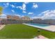 Beautiful backyard with pool and lush turf, ideal for relaxation and outdoor activities at 12565 W Palmaire Ave, Glendale, AZ 85307