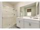 Modern bathroom with double vanity, a glass-enclosed shower, and stylish fixtures at 12565 W Palmaire Ave, Glendale, AZ 85307