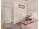 Bright bedroom features a cozy vanity, wood-look flooring, and ample natural light at 12565 W Palmaire Ave, Glendale, AZ 85307