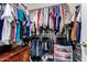 Well-organized walk-in closet providing ample storage space for clothing and accessories at 12565 W Palmaire Ave, Glendale, AZ 85307
