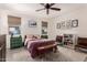 Tranquil main bedroom featuring a ceiling fan, two windows, and a calm and cozy atmosphere at 12565 W Palmaire Ave, Glendale, AZ 85307