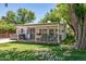 Charming backyard featuring lush lawn, patio area, and a private hot tub at 1306 W Heatherbrae Dr, Phoenix, AZ 85013