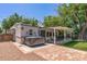 Backyard with a covered patio, hot tub, and lush greenery at 1306 W Heatherbrae Dr, Phoenix, AZ 85013
