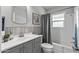 Cozy bathroom featuring a tiled shower and vanity with updated fixtures at 1306 W Heatherbrae Dr, Phoenix, AZ 85013