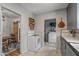 Kitchen with vintage appliances and access to the laundry area at 1306 W Heatherbrae Dr, Phoenix, AZ 85013