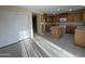 Spacious kitchen with oak cabinets, center island, and tile floors at 1352 S 221St Ln, Buckeye, AZ 85326
