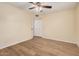 Spacious bedroom featuring a ceiling fan, laminate floors and a closet at 14402 N 58Th Dr, Glendale, AZ 85306