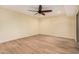 Bedroom featuring hardwood floors and ceiling fan at 14402 N 58Th Dr, Glendale, AZ 85306