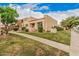 Attractive exterior view of a well-manicured property with desert landscaping and a charming walkway at 14402 N 58Th Dr, Glendale, AZ 85306