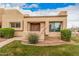 Welcoming desert home with an inviting front entrance and mature shrubbery enhancing its curb appeal at 14402 N 58Th Dr, Glendale, AZ 85306