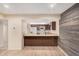 Open concept kitchen with breakfast bar, wood cabinets, and white appliances at 14402 N 58Th Dr, Glendale, AZ 85306