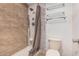 Shower featuring tile surround and multiple shower heads at 14402 N 58Th Dr, Glendale, AZ 85306