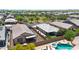 Aerial view of a house and surrounding neighborhood with mature trees and a pool at 14408 W Bloomfield Rd, Surprise, AZ 85379