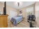 Cozy bedroom with a ceiling fan, ample closet space, and natural light at 14408 W Bloomfield Rd, Surprise, AZ 85379