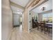 Hallway view into dining area featuring tile floors and neutral walls at 14408 W Bloomfield Rd, Surprise, AZ 85379