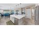 Open kitchen with a large island, stainless steel appliances, and views to the living room at 14408 W Bloomfield Rd, Surprise, AZ 85379