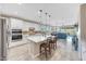 Bright, open-concept kitchen boasts an island, stainless appliances, and seamless access to the living space at 14408 W Bloomfield Rd, Surprise, AZ 85379