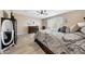 Relaxing main bedroom featuring a patterned bedspread, neutral walls, and natural light at 14408 W Bloomfield Rd, Surprise, AZ 85379