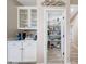 Well-organized pantry with ample shelving, adjacent to a convenient coffee bar area at 14408 W Bloomfield Rd, Surprise, AZ 85379