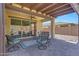 Comfortable covered patio for outdoor lounging and entertaining at 14408 W Bloomfield Rd, Surprise, AZ 85379