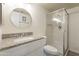 Clean bathroom featuring granite countertops, modern fixtures, and a sleek glass-enclosed shower at 14624 N 44Th St, Phoenix, AZ 85032
