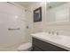 Modern bathroom featuring dark cabinets, quartz countertops, and a shower-tub combination at 14624 N 44Th St, Phoenix, AZ 85032