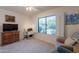 Cozy bedroom featuring a bright window and a workspace, blending comfort with functionality at 14624 N 44Th St, Phoenix, AZ 85032