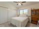 Bright bedroom with a large window and ample closet space, creating a serene and organized retreat at 14624 N 44Th St, Phoenix, AZ 85032