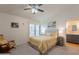 Bright bedroom featuring neutral walls, vaulted ceiling, and a cozy seating area for relaxation at 14624 N 44Th St, Phoenix, AZ 85032