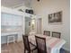 Elegant dining area with views to the modern kitchen, bathed in natural light with seamless entertaining at 14624 N 44Th St, Phoenix, AZ 85032