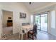 Bright dining area with a view of the pool, creating a relaxing atmosphere for meals at 14624 N 44Th St, Phoenix, AZ 85032