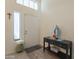 Bright foyer with neutral walls, a high ceiling and a decorative table at 14624 N 44Th St, Phoenix, AZ 85032