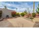Backyard features a concrete area with an outdoor grill and lush greenery at 1535 N Horne -- # 67, Mesa, AZ 85203