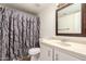 Cozy bathroom featuring a vanity sink, toilet, and shower with a decorative curtain at 1535 N Horne -- # 67, Mesa, AZ 85203