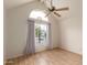 A bright room featuring a high vaulted ceiling and a large window with outdoor views at 1535 N Horne -- # 67, Mesa, AZ 85203