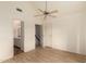 Bedroom with wood floors, vaulted ceiling, and view into bathroom and hallway at 1535 N Horne -- # 67, Mesa, AZ 85203