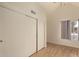 Bedroom featuring wood floors, vaulted ceilings, and a large closet at 1535 N Horne -- # 67, Mesa, AZ 85203