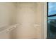 Spacious walk-in closet featuring wire shelving and a window to allow natural light at 1535 N Horne -- # 67, Mesa, AZ 85203
