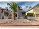 Stylish two-story home with stucco exterior, desert landscaping, and a gated front entrance at 1535 N Horne -- # 67, Mesa, AZ 85203