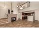 Spacious living area with soaring ceilings, fireplace and a staircase leading to the second floor loft at 1535 N Horne -- # 67, Mesa, AZ 85203