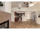 Open-concept living room showcasing fireplace and open kitchen, creating a bright and welcoming space with high ceilings at 1535 N Horne -- # 67, Mesa, AZ 85203
