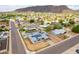 Wonderful aerial view of the home with a sparkling pool, solar panels, and desert landscaping at 1550 W Willow Ave, Phoenix, AZ 85029