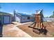 Spacious backyard featuring a storage shed, playground, and solar panels at 1550 W Willow Ave, Phoenix, AZ 85029