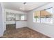 Cozy dining area with updated flooring and lots of light from a large window at 1550 W Willow Ave, Phoenix, AZ 85029