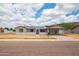 Inviting home with solar panels, carport, desert landscaping, and street view at 1550 W Willow Ave, Phoenix, AZ 85029