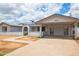 Lovely home exterior with desert landscaping, solar panels, and covered carport at 1550 W Willow Ave, Phoenix, AZ 85029